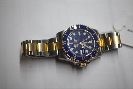 A gentlemens stainless steel and yellow gold Rolex Oyster Perpetual Date Submariner wrist watch,